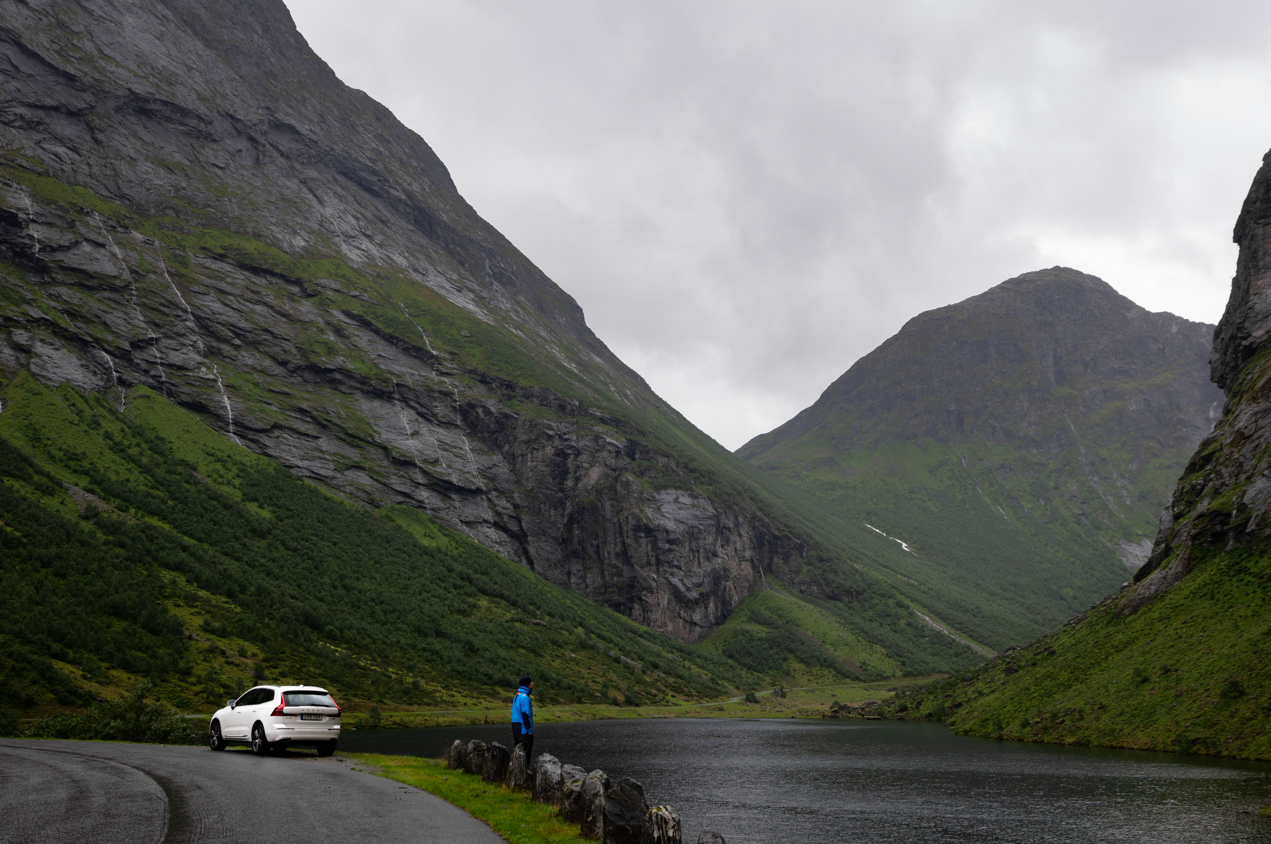 Volvo XC60 and man by lake